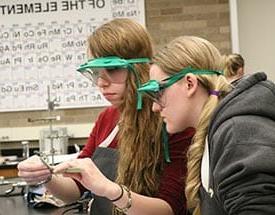 Two girls in a science lab